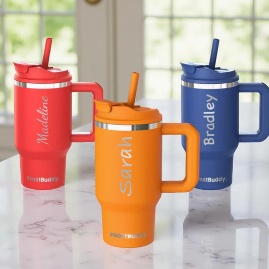 This image shows 3 kids 16oz frostbuddy insulated tumbler with a name personalized onto the cup. It is a permanent engraving
