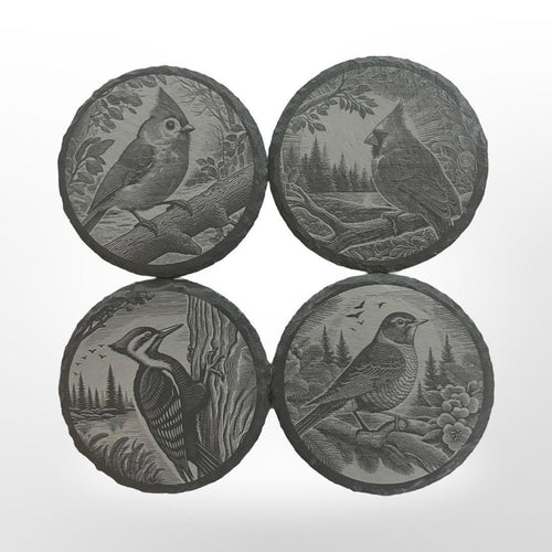 Slate Coasters set of 4 that have different birds engraved onto them like cardinal, tufted titmouse, robin, and pileated woodpecker