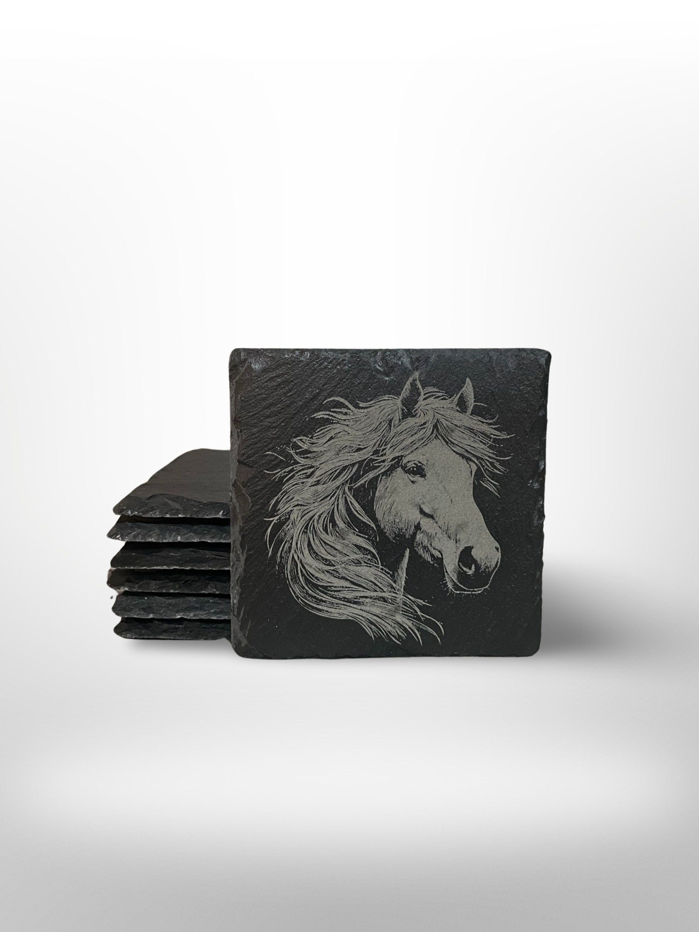 Slate coaster with an oversized horse head engraved onto it