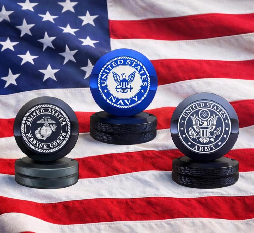 Nicotine pouch tins that have engraved military logos like marines, navy and army