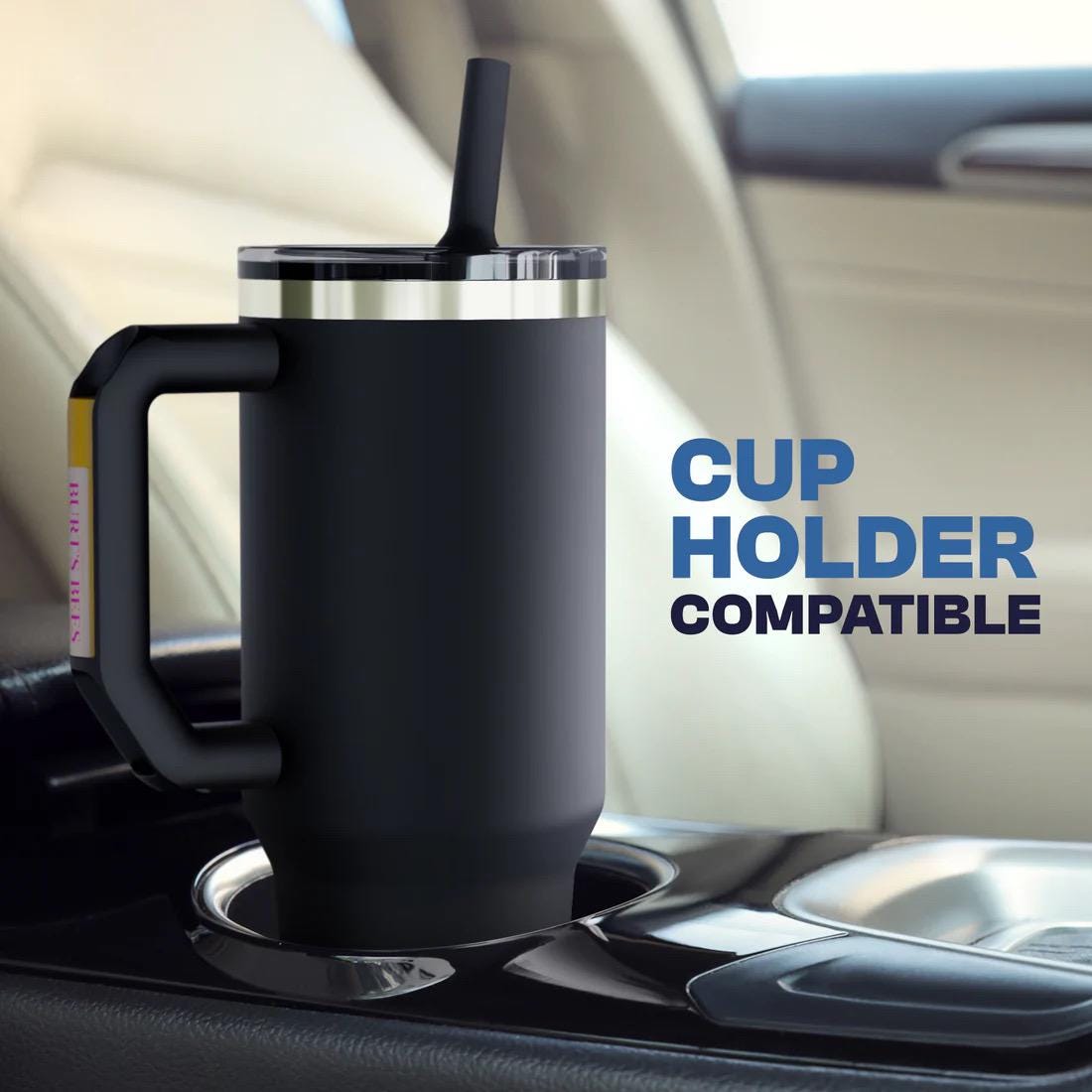Black insulated mug with straw in a car cup holder, text 'Cup Holder Compatible' displayed.